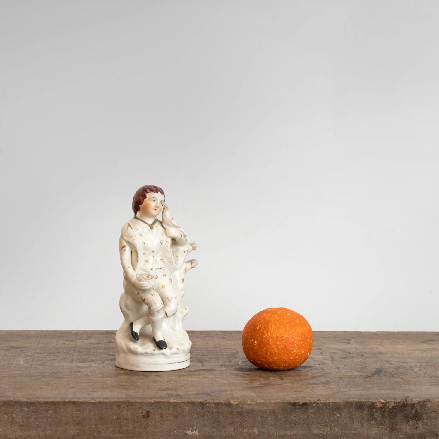 STAFFORDSHIRE FIGURINE OF A BOY WITH BIRD