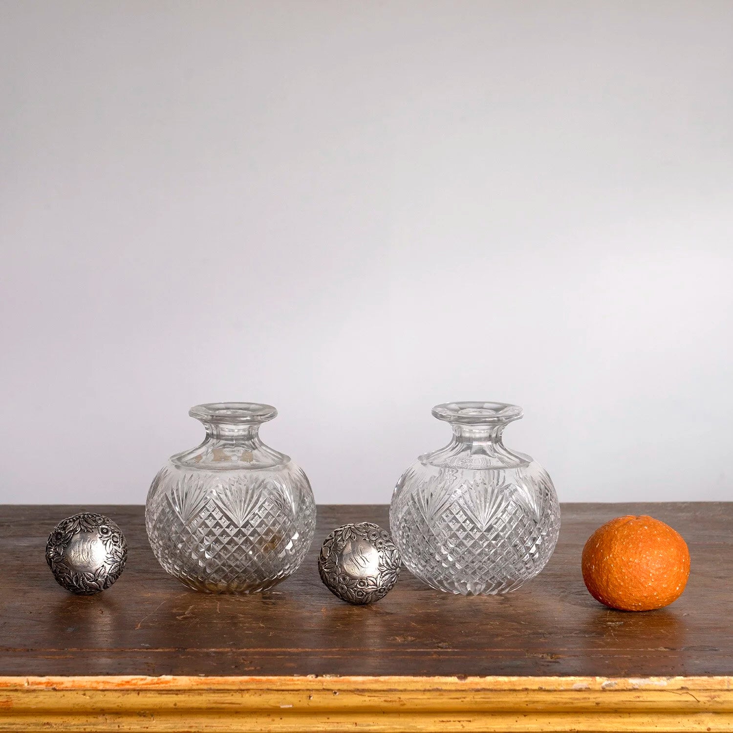 PAIR OF ENGLISH EDWARDIAN SILVER TOPPED PERFUME BOTTLES