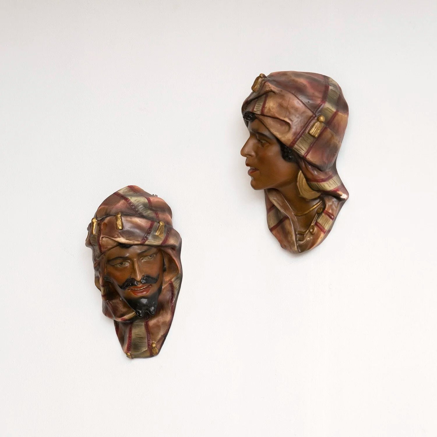 PAIR OF PAINTED PLASTER HEADS - A