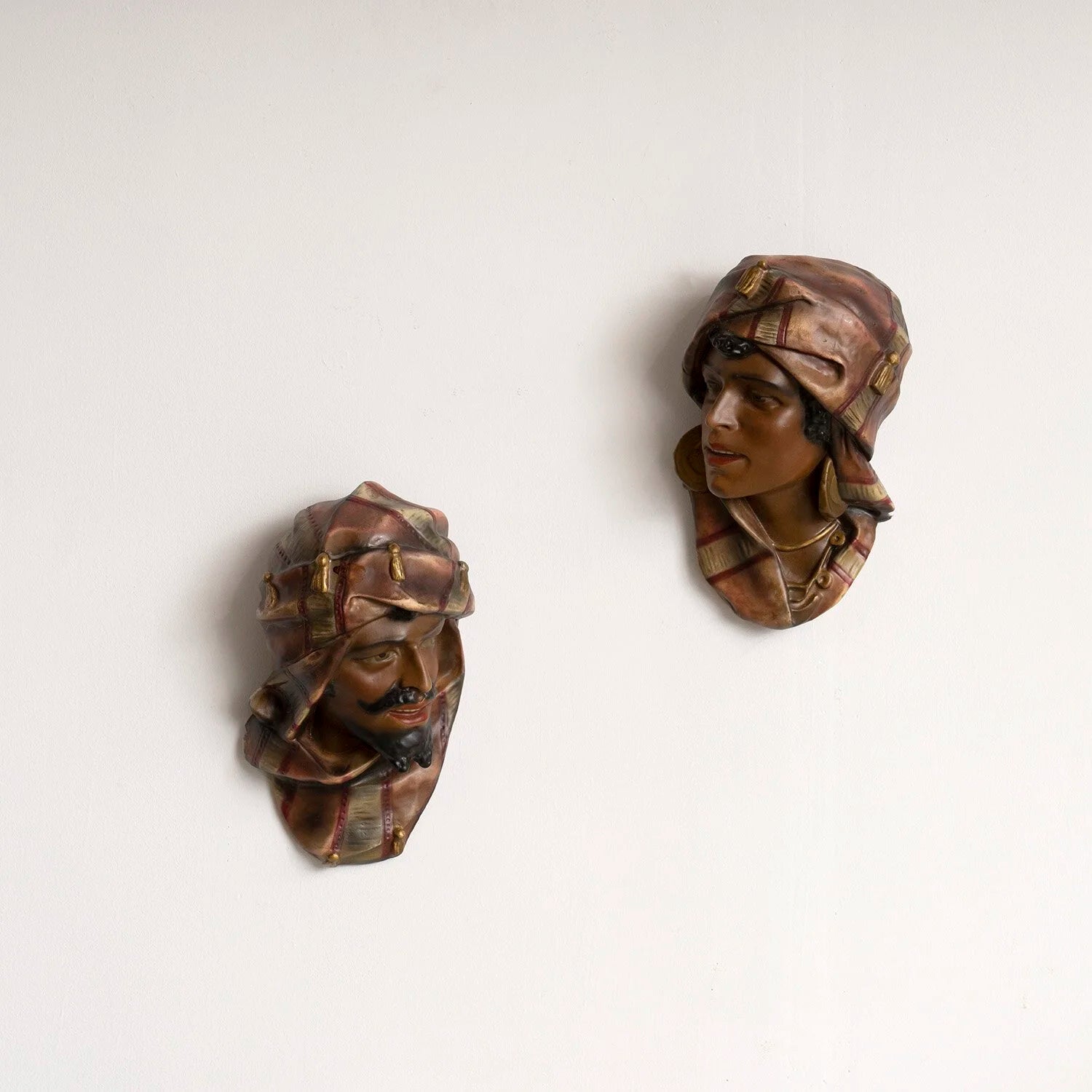 PAIR OF PAINTED PLASTER HEADS - A