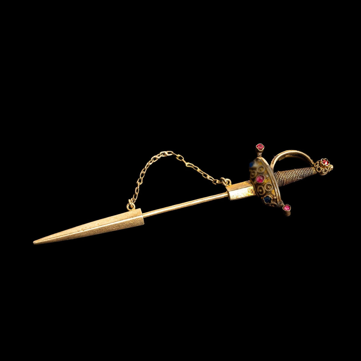 LATE 19TH CENTURY GOLD VERMEIL SWORD JABOT PIN WITH RUBY AND SAPPHIRE ACCENTS, detail view