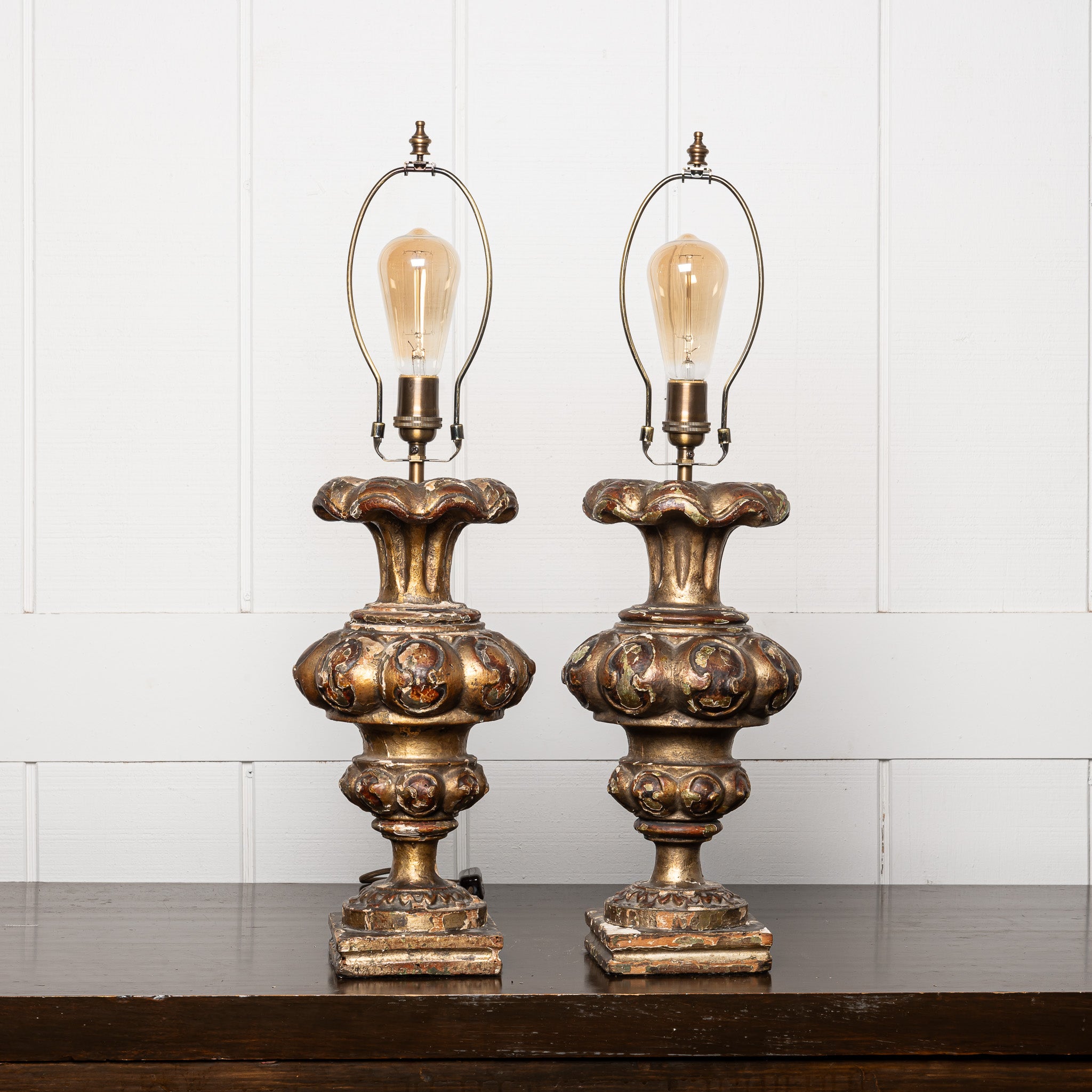 PAIR OF 18TH-CENTURY ITALIAN BAROQUE GILTWOOD "ALTAR CANDLESTICKS" MOUNTED AS TABLE LAMPS
