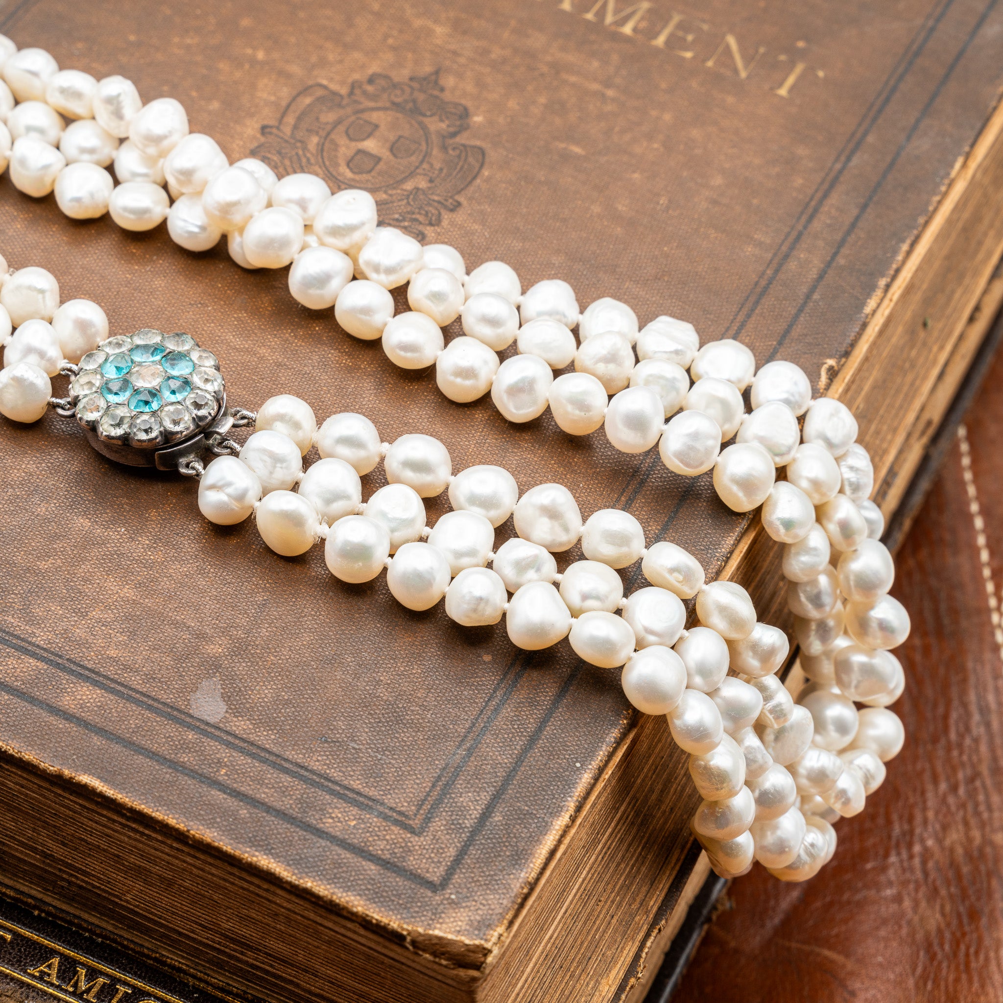 GEORGIAN NATURAL BAROQUE PEARL TRIPLE STRAND NECKLACE WITH PASTE CLASP