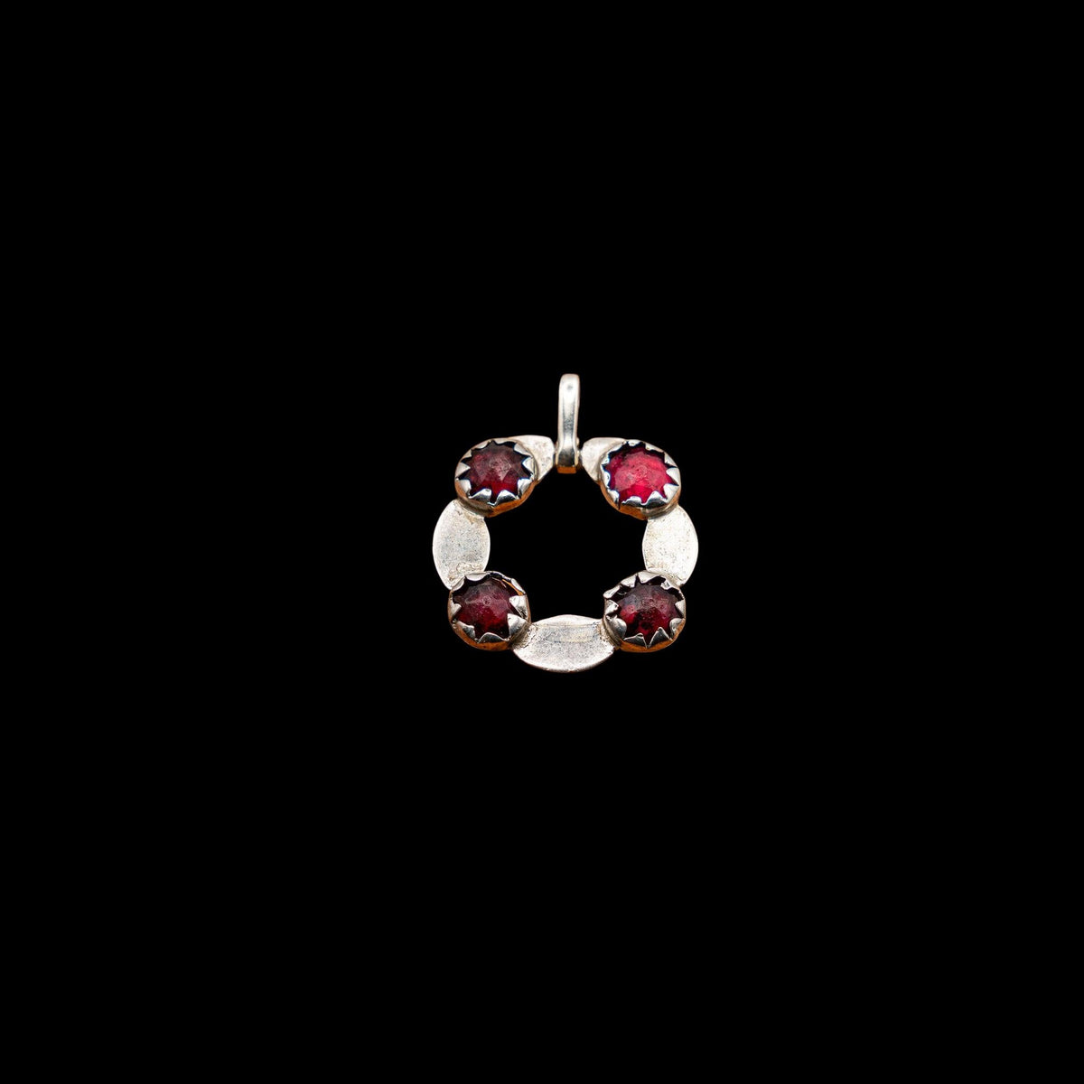 GEORGIAN ENGLISH SILVER AND FOIL BACKED GARNET PENDANT, CONVERTED FROM A BUCKLE, detail view