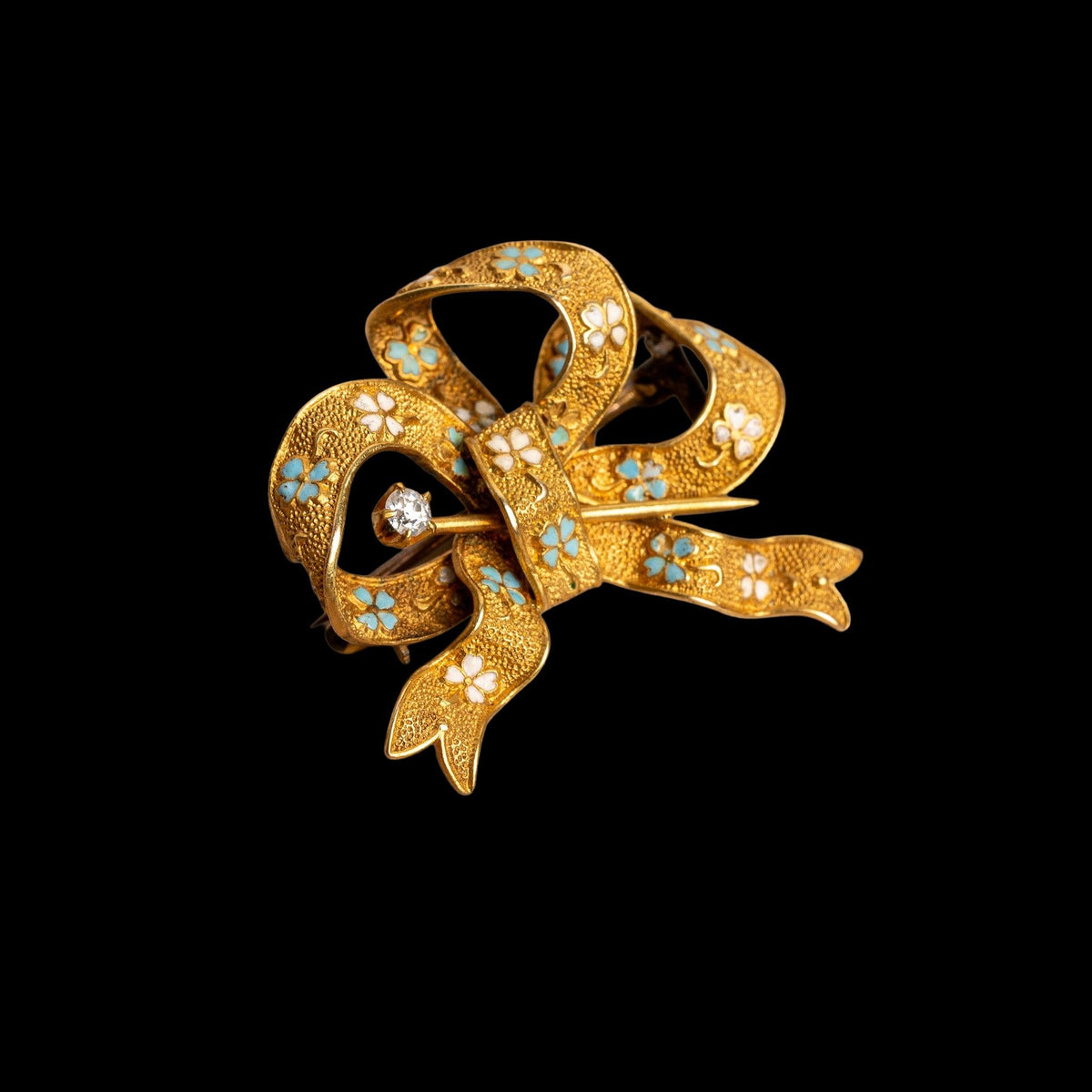 LATE 19TH CENTURY VICTORIAN 14K GOLD, ENAMEL, AND DIAMOND BOW BROOCH, detail view