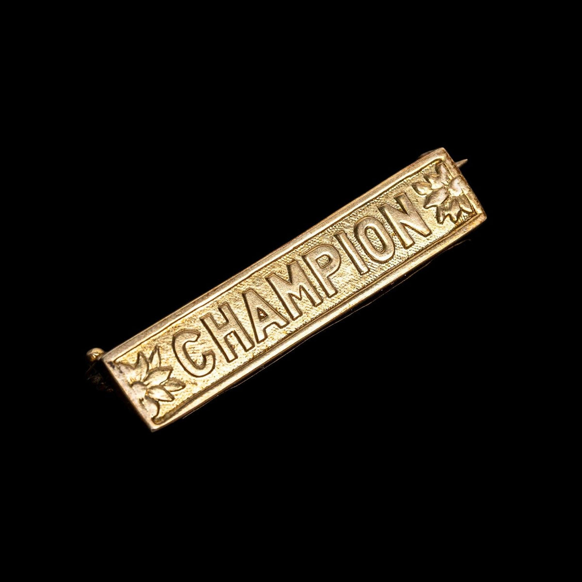“CHAMPION” STERLING SILVER PIN FROM THE ORIGINAL SAVED COLLECTION, detail view