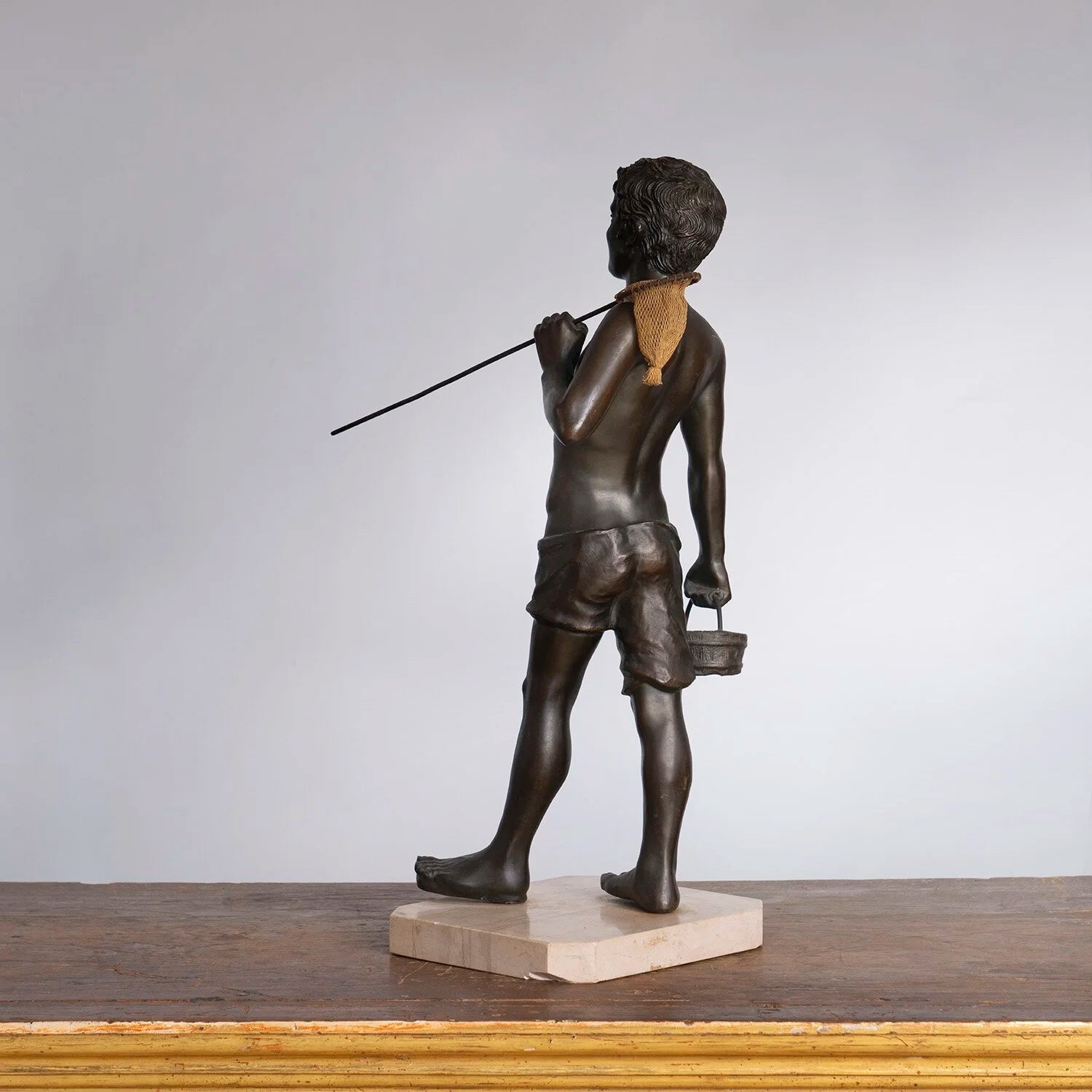 STATUE OF A FISH MONGER