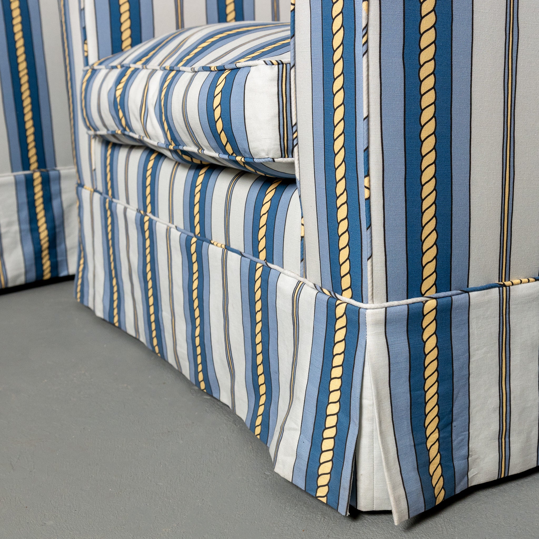 Pair of mid-century American club chairs newly upholstered in DNR Ropes and Strioes fabric