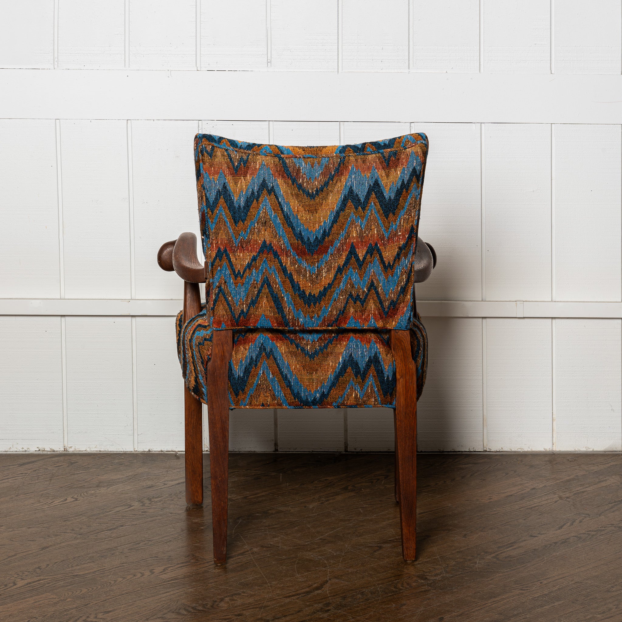 Early 20th century carved German armchair newly upholstered in a vintage flamestich fabrci