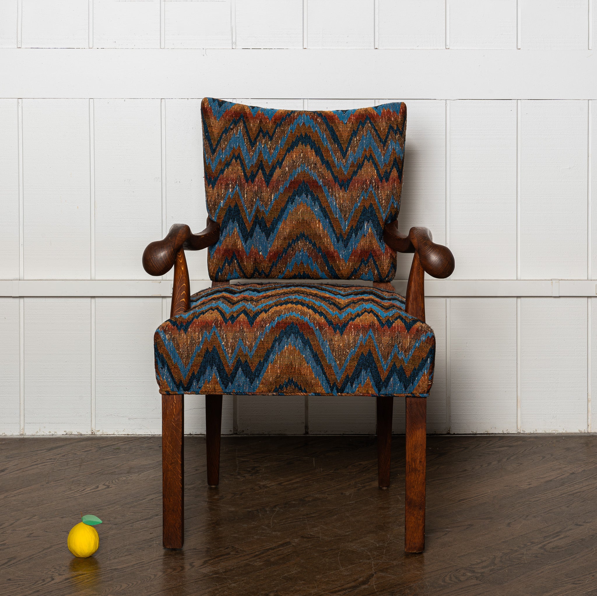 Early 20th century carved German armchair newly upholstered in a vintage flamestich fabrci