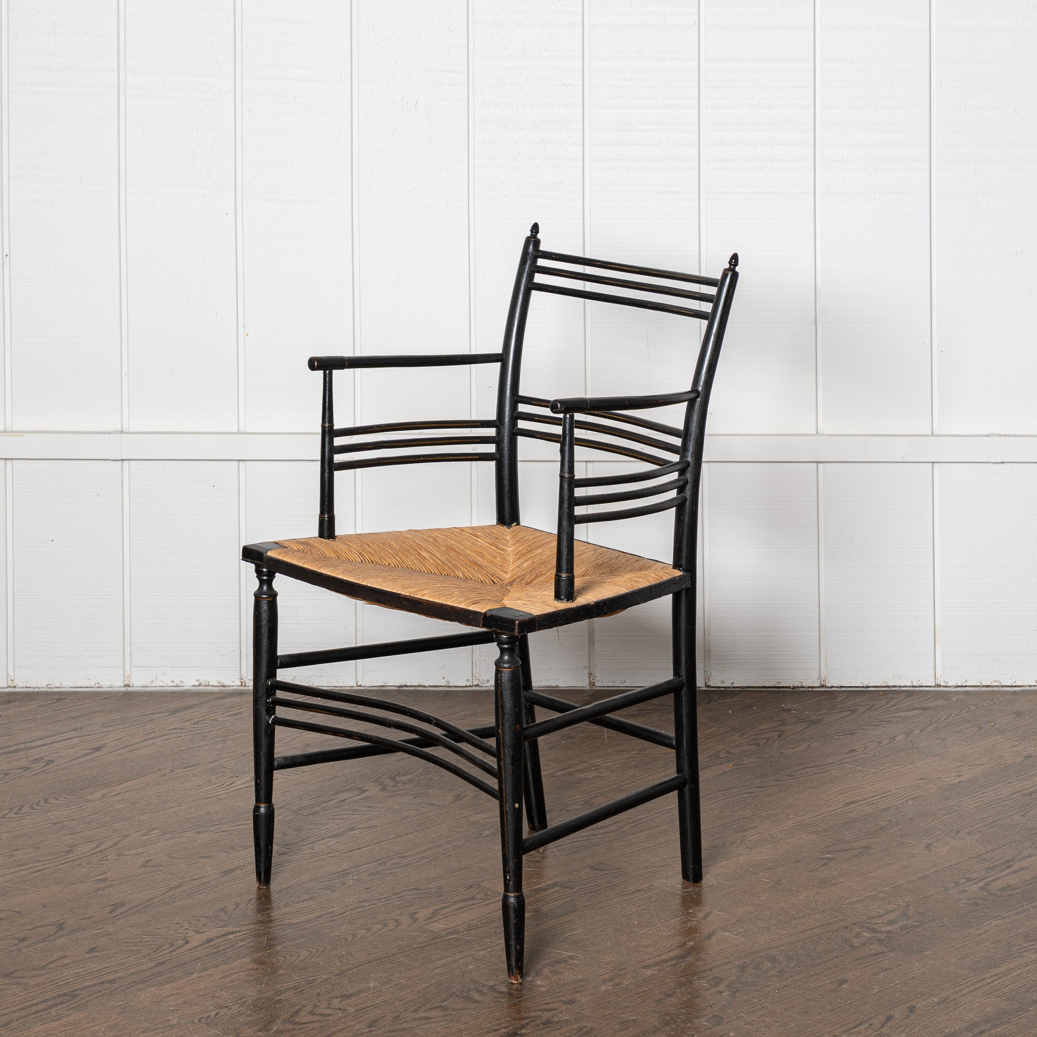19th century English Aesthetic Movemnt ebonized rushseat armchair