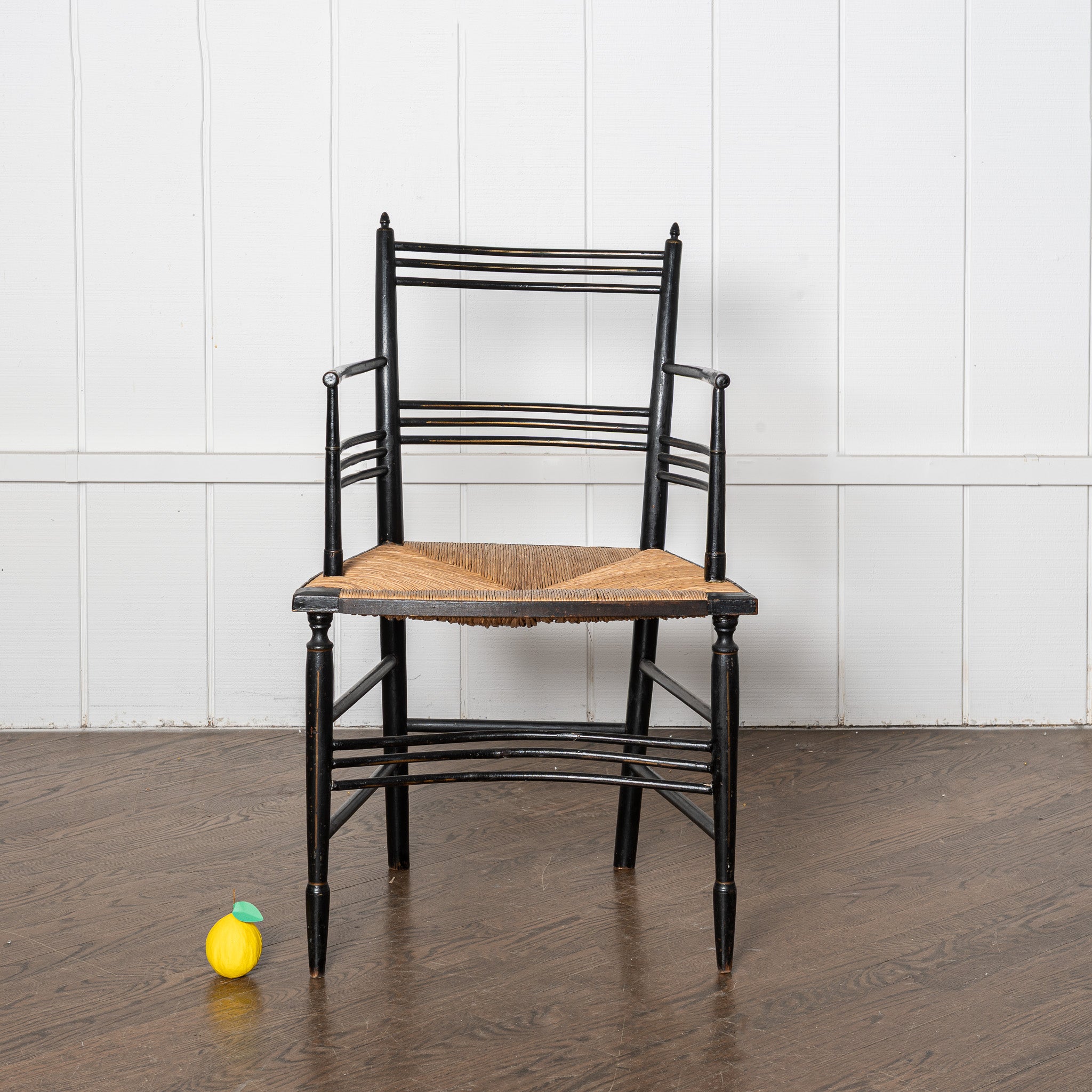19th century English Aesthetic Movemnt ebonized rushseat armchair