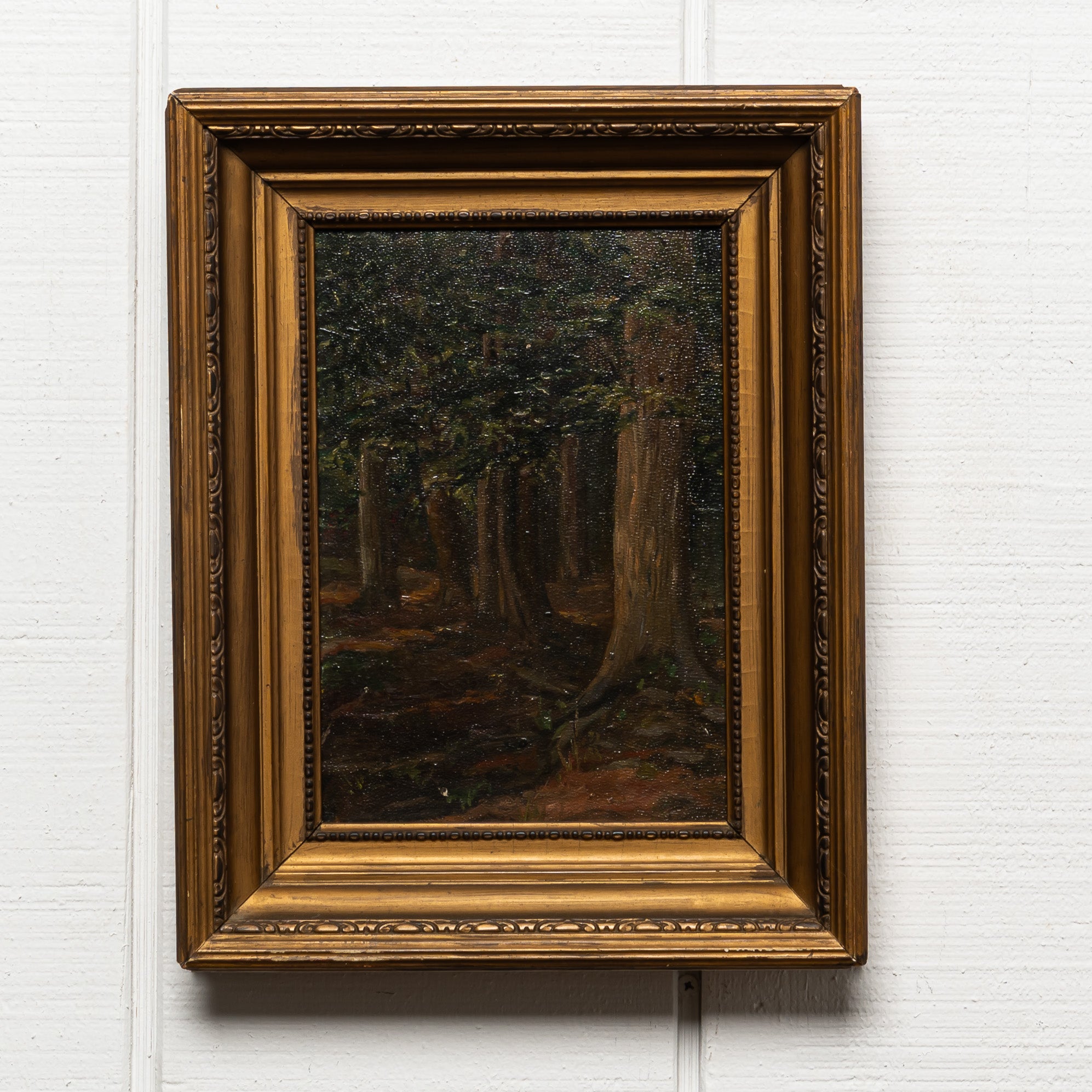 19TH-CENTURY OIL ON WOOD OF A FOREST INTERIOR