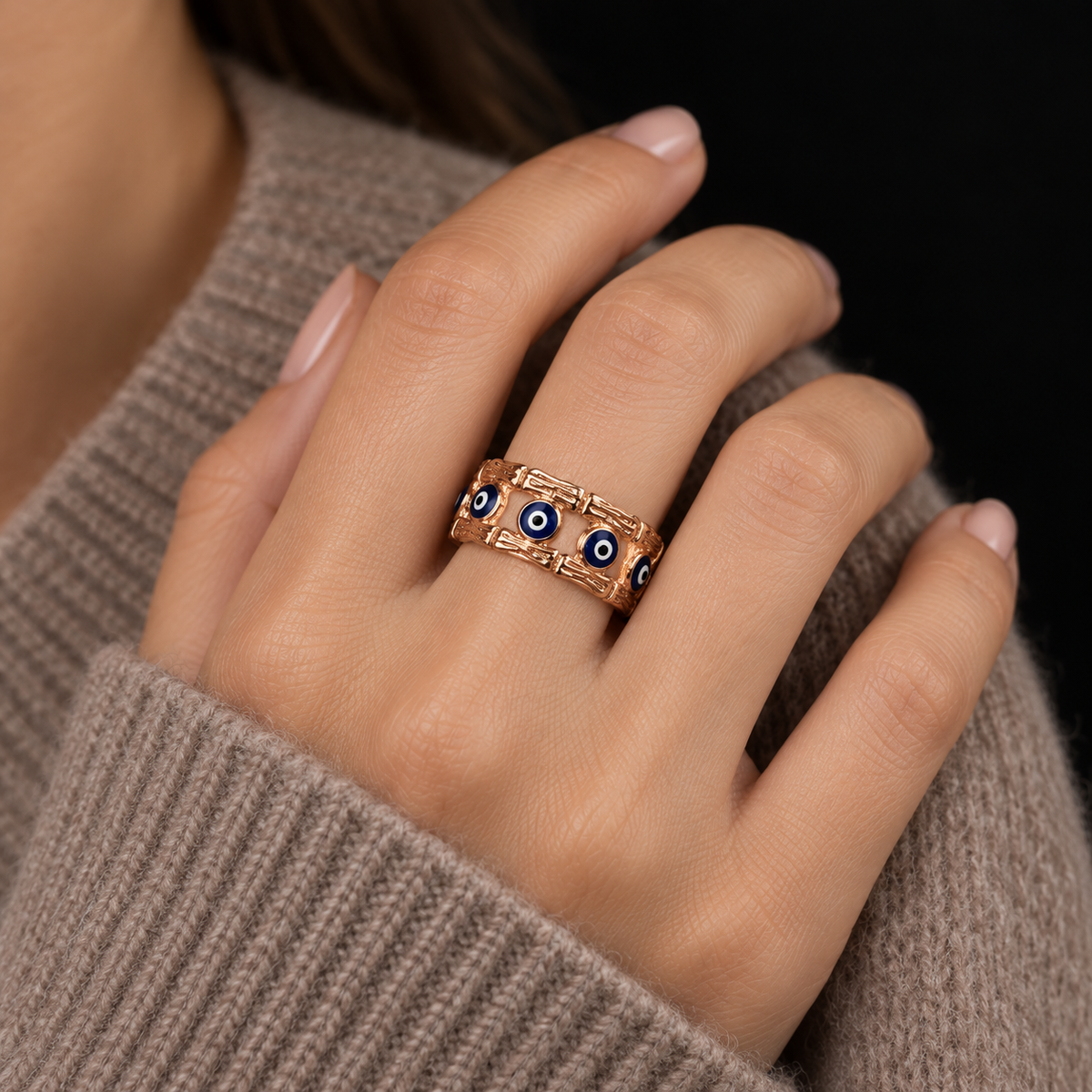 AI STYLING ILLUSTRATION OF EVIL EYE ROSE GOLD VERMEIL RING WORN ON HAND