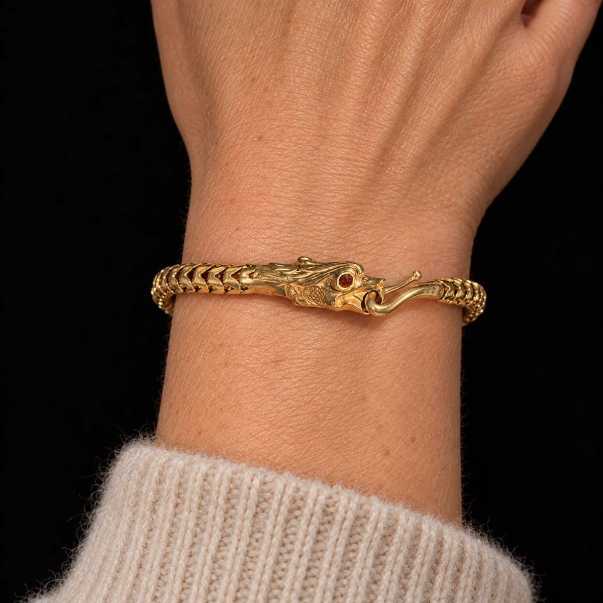 Illustrative styling view of the snake bracelet with an oatmeal cashmere cuff