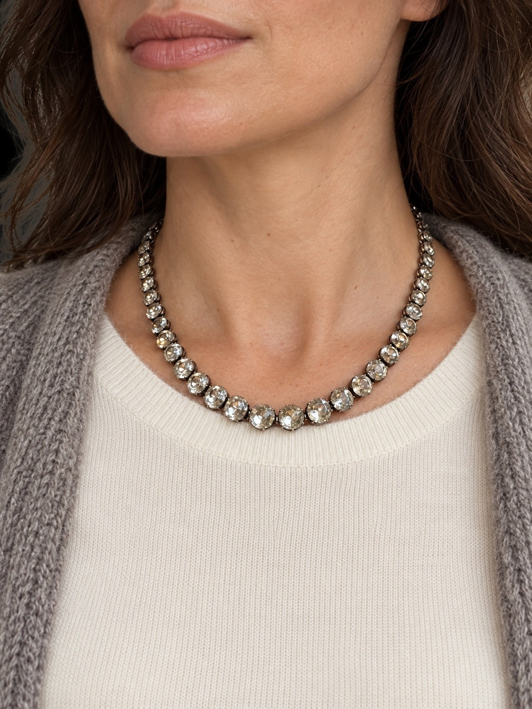 EARLY 20TH CENTURY PASTE RIVIÈRE NECKLACE WITH ALEXANDRITE CLASP — worn view