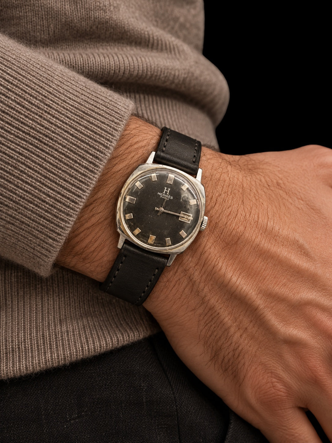 VINTAGE WATCH WITH HERMÈS SIGNED BLACK DIAL AND DATE — worn view