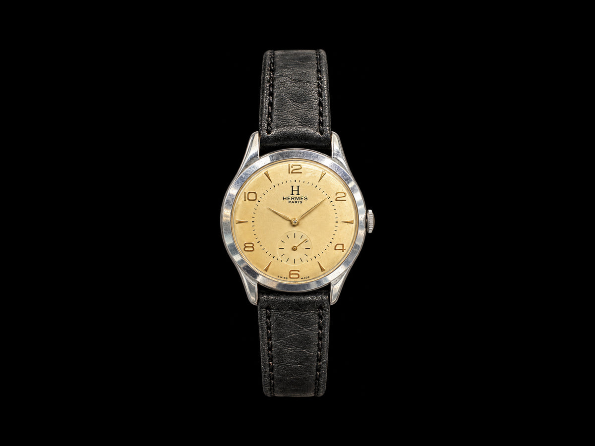 VINTAGE WATCH WITH HERMÈS SIGNED CHAMPAGNE DIAL — front view