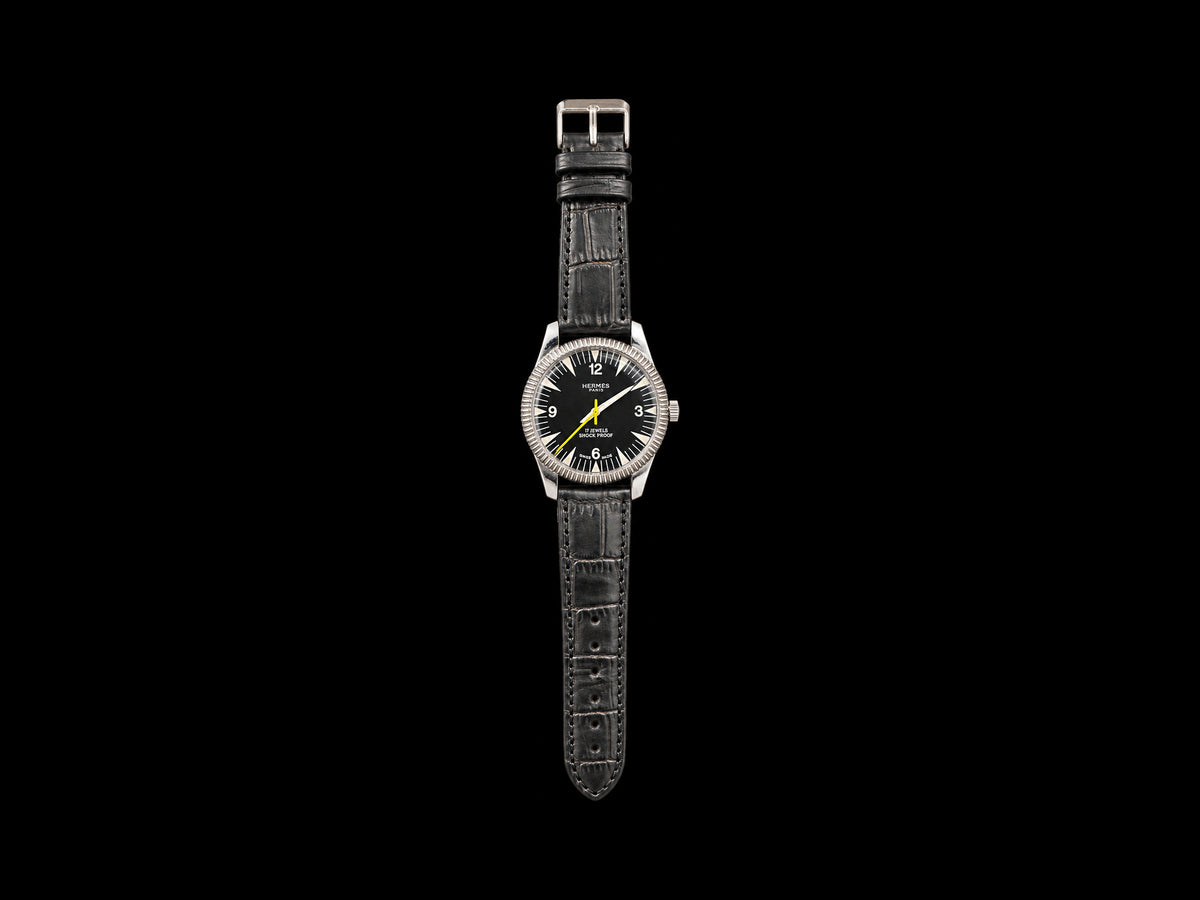 VINTAGE WATCH WITH HERMÈS SIGNED BLACK DIAL — front view