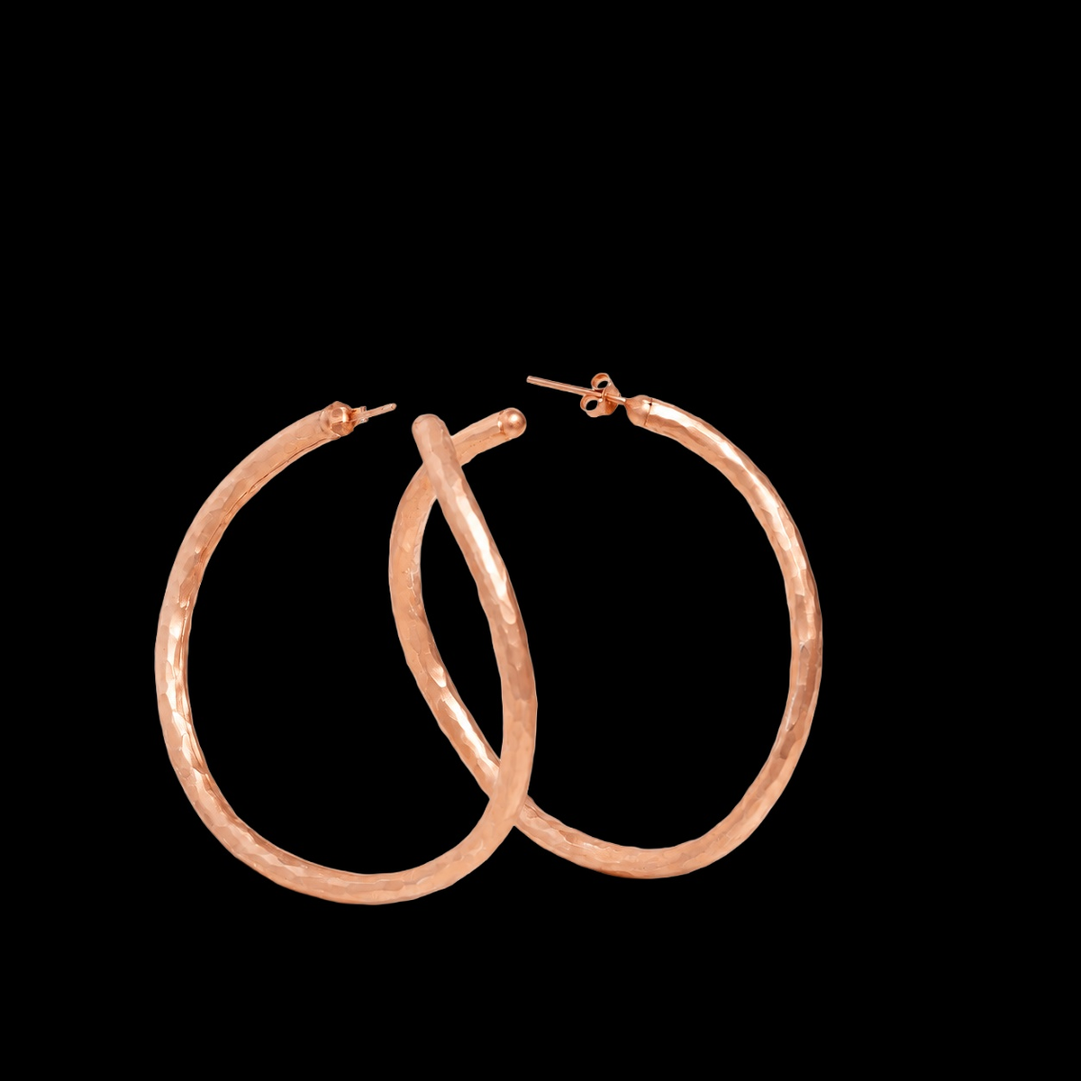 LARGE HAMMERED ROSE GOLD VERMEIL HOOP EARRINGS on black background