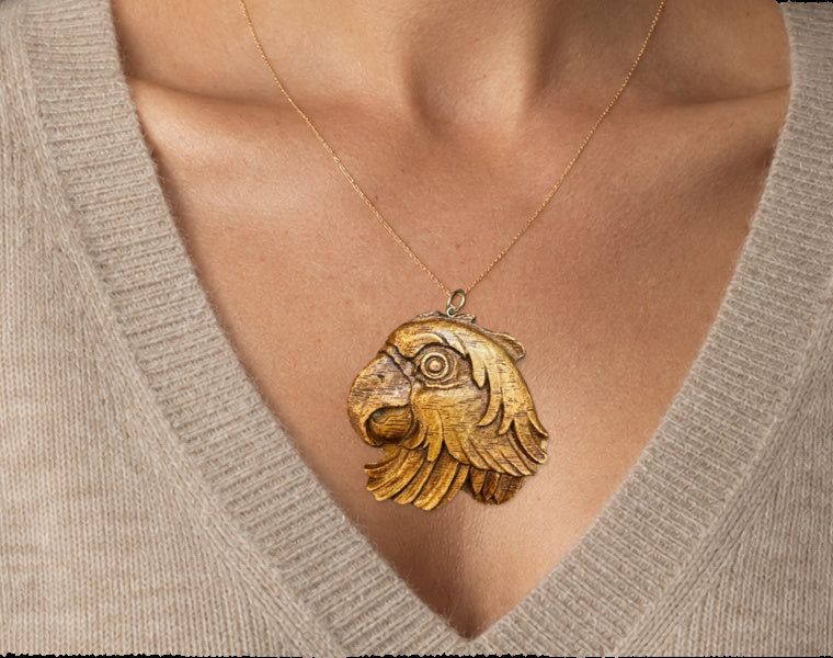 1940S AMERICAN PRESSED WOOD PARROT PENDANT WITH 14 KARAT GOLD — worn view