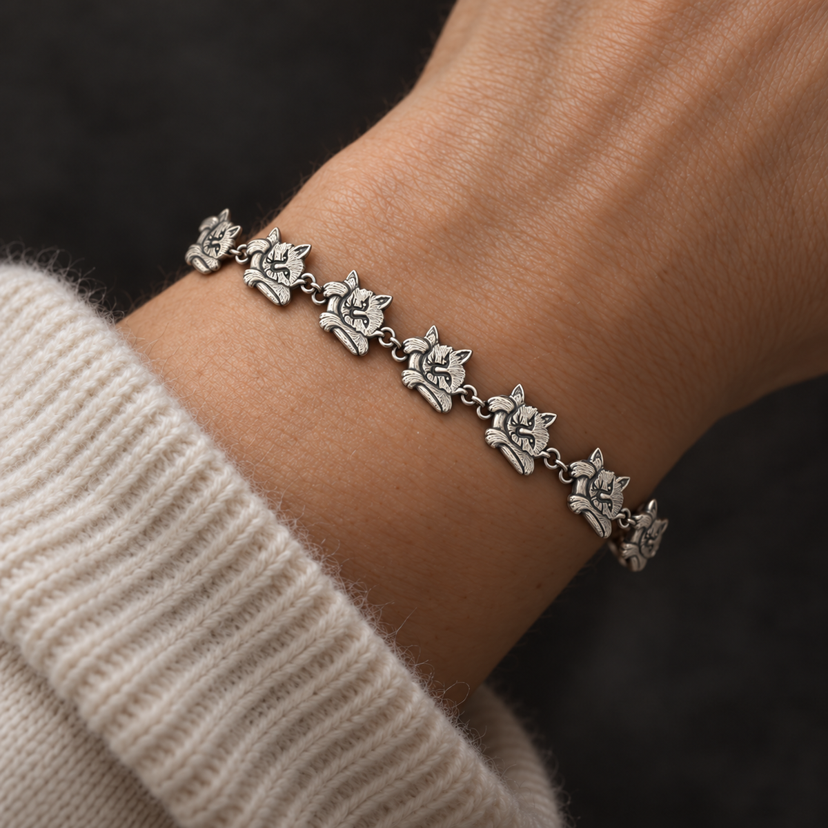 AI styling illustration of the silver cat bracelet worn on a model