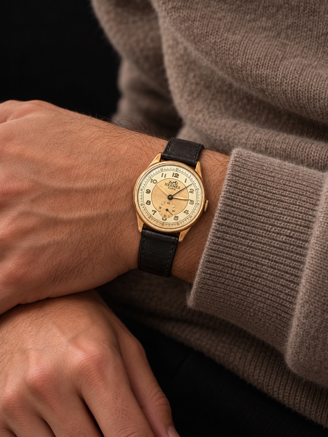 ILLUSTRATIVE MODEL STYLING WITH VINTAGE WATCH WITH HERMÈS SIGNED ARABIC DIAL AND CASHMERE