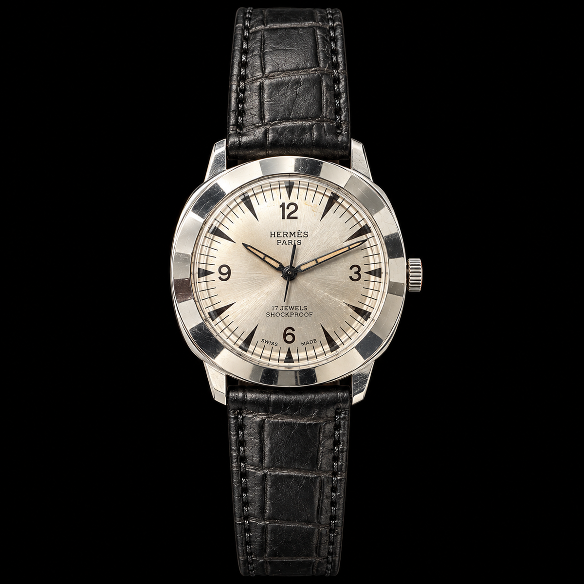 VINTAGE WATCH WITH HERMÈS SIGNED SILVER DIAL ON BLACK BACKGROUND