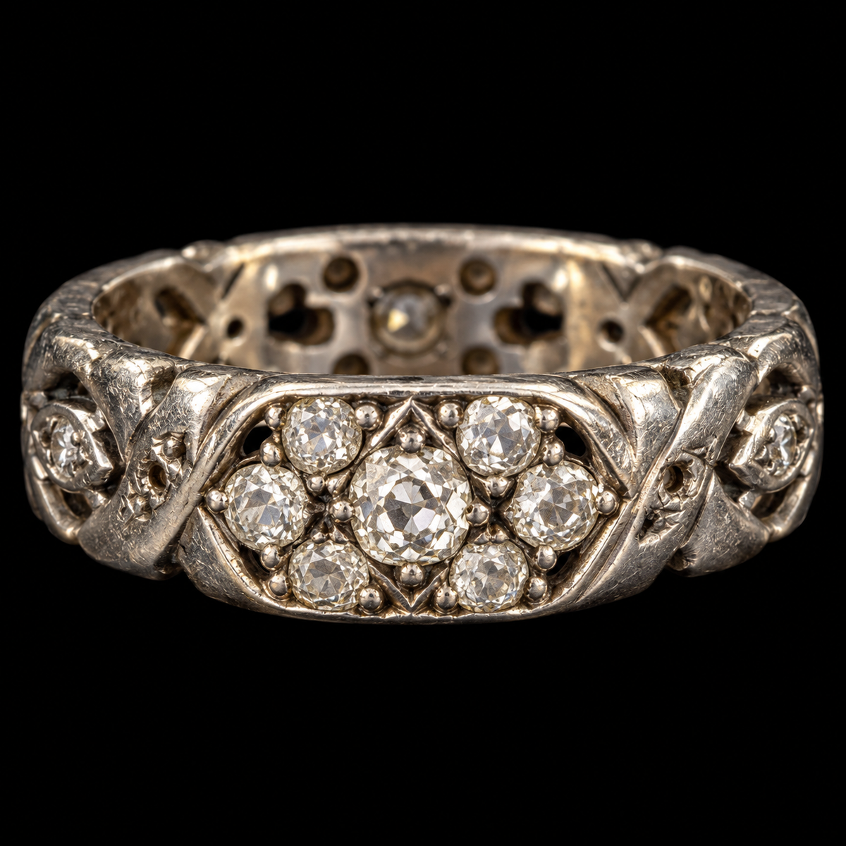 WHITE GOLD OLD MINE CUT DIAMOND X AND O ETERNITY BAND ON BLACK BACKGROUND
