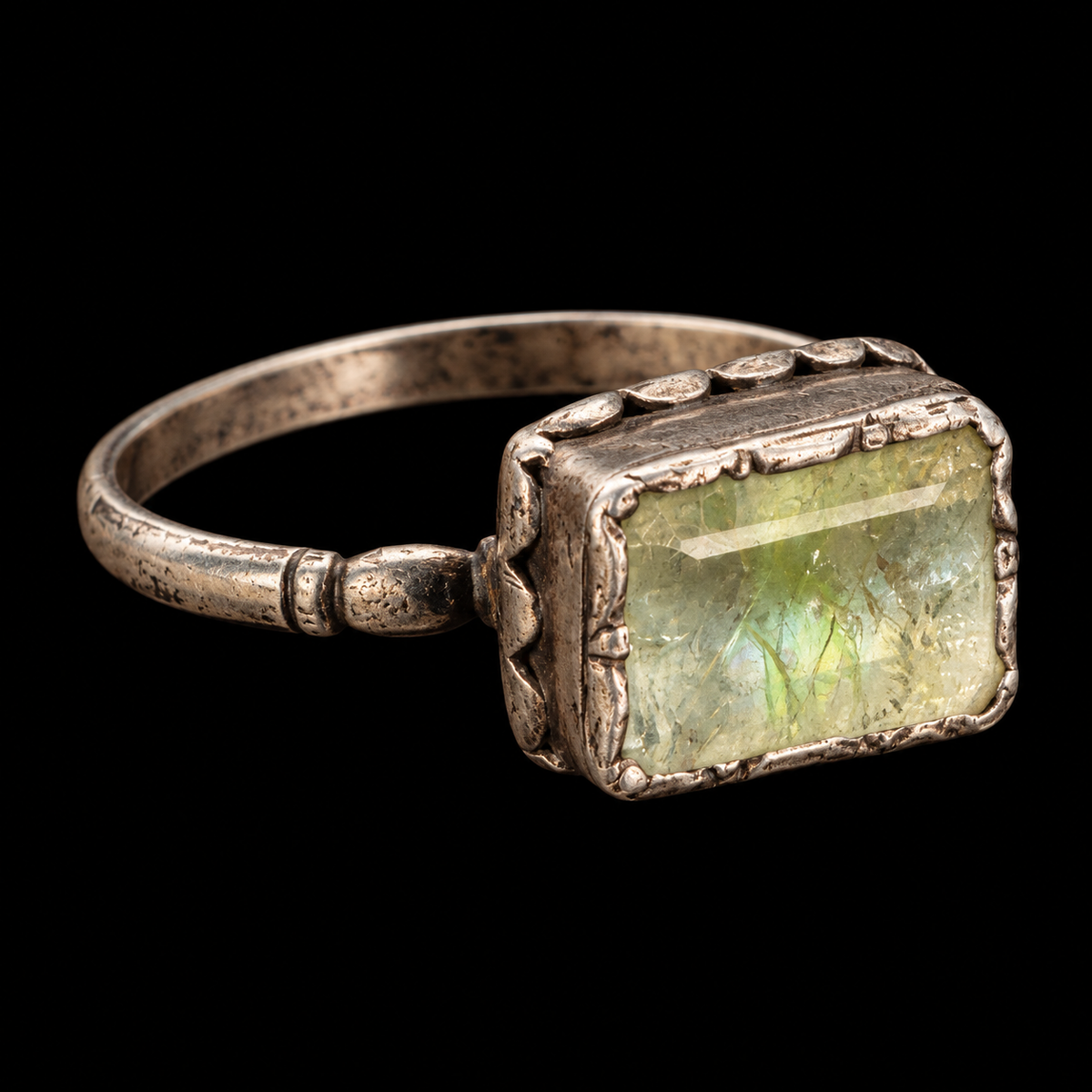 17TH CENTURY EMERALD RING IN SILVER ON BLACK BACKGROUND