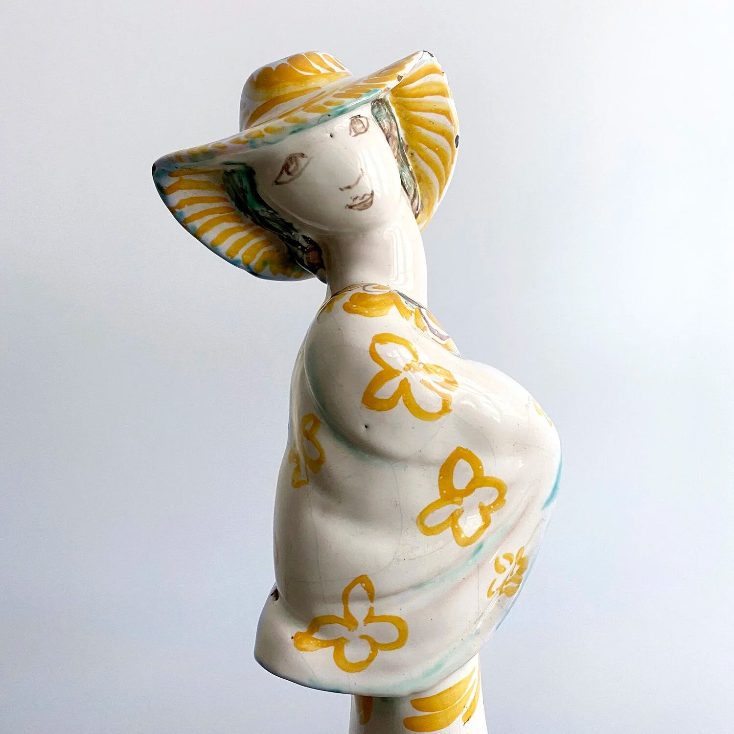 TERRACOTTA FIGURE OF A WOMAN