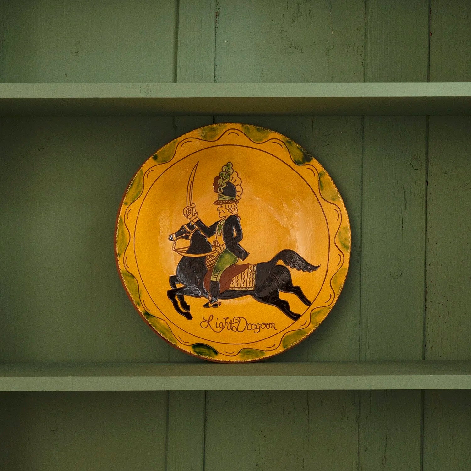 REDWARE PLATE OF BRITISH SOLDIER ON HORSEBACK