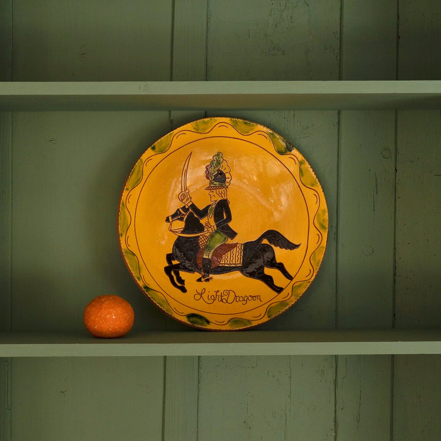 REDWARE PLATE OF BRITISH SOLDIER ON HORSEBACK
