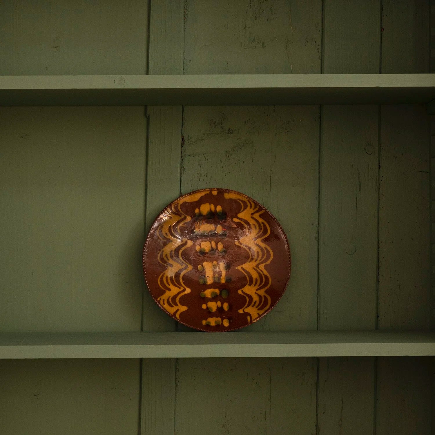 REDWARE PLATE WITH ZIG ZAG PATTERN