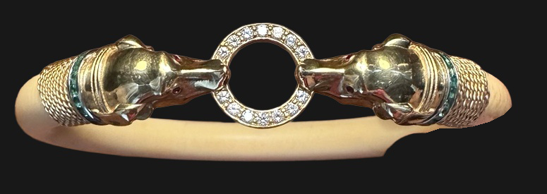 Actual French Art Deco bangle photograph: hound’s-head gold terminals, emerald collars, ruby eyes and diamond ring.