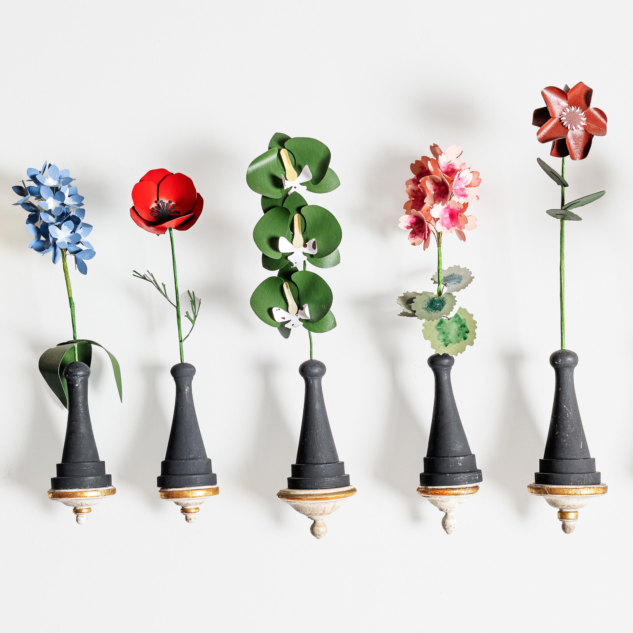 COLLECTION OF SIXTEEN 18TH-CENTURY ANTIQUE WALL BRACKETS WITH PAPER  FLOWERS ON HAND TURNED WOOD BASES