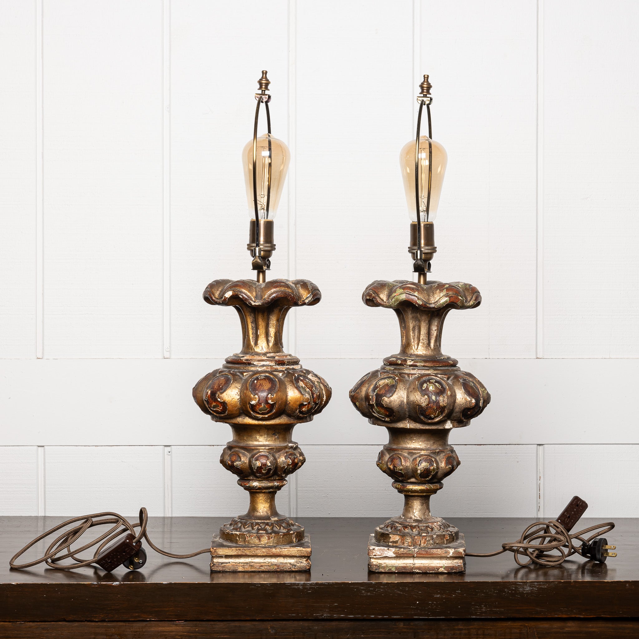 PAIR OF 18TH-CENTURY ITALIAN BAROQUE GILTWOOD "ALTAR CANDLESTICKS" MOUNTED AS TABLE LAMPS