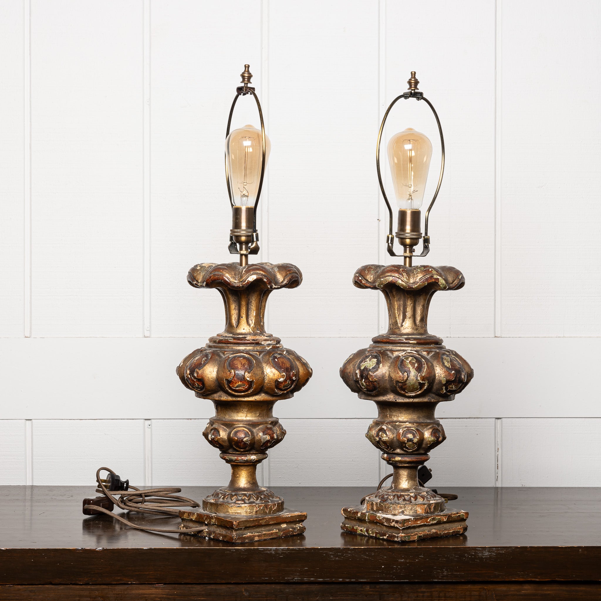 PAIR OF 18TH-CENTURY ITALIAN BAROQUE GILTWOOD "ALTAR CANDLESTICKS" MOUNTED AS TABLE LAMPS