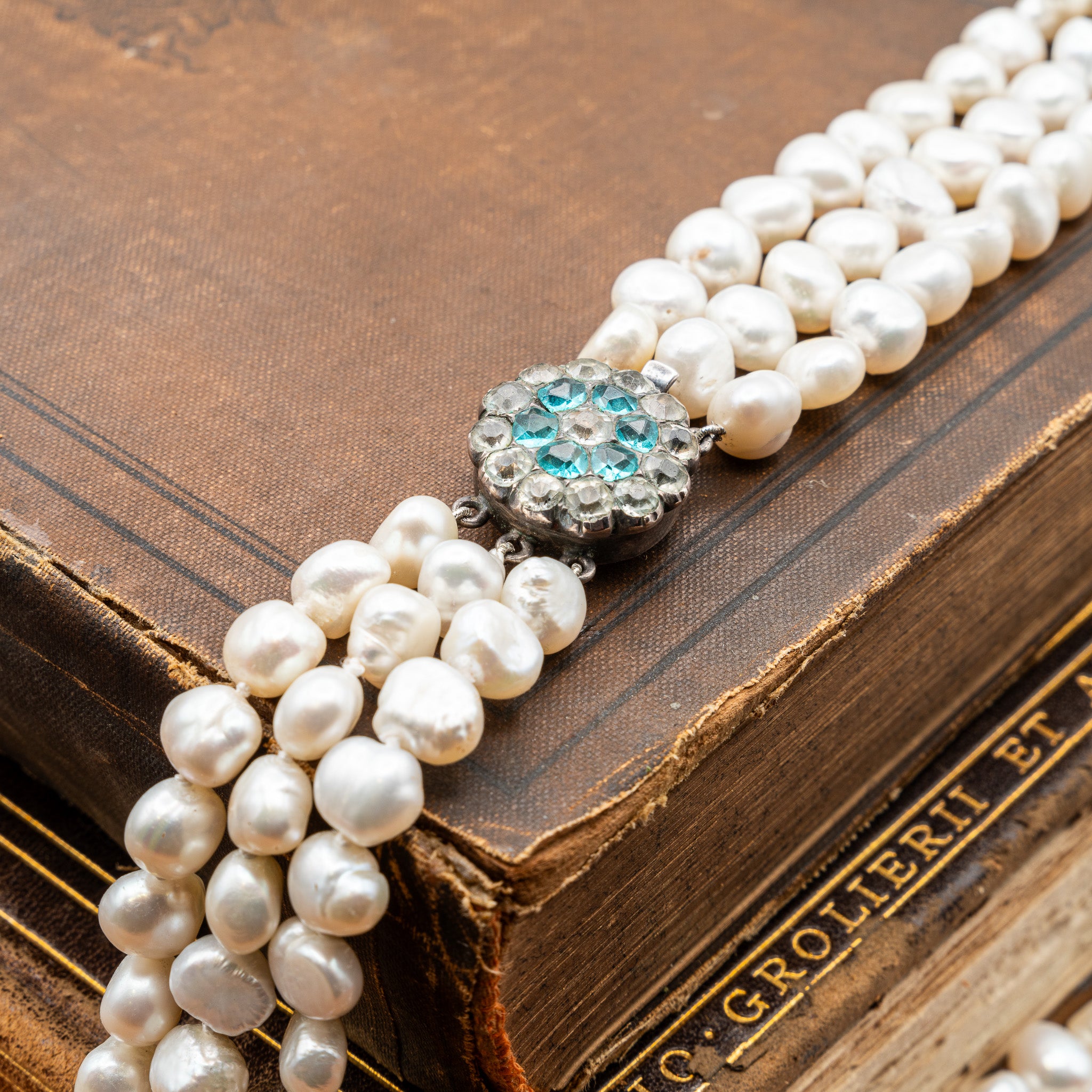 GEORGIAN NATURAL BAROQUE PEARL TRIPLE STRAND NECKLACE WITH PASTE CLASP