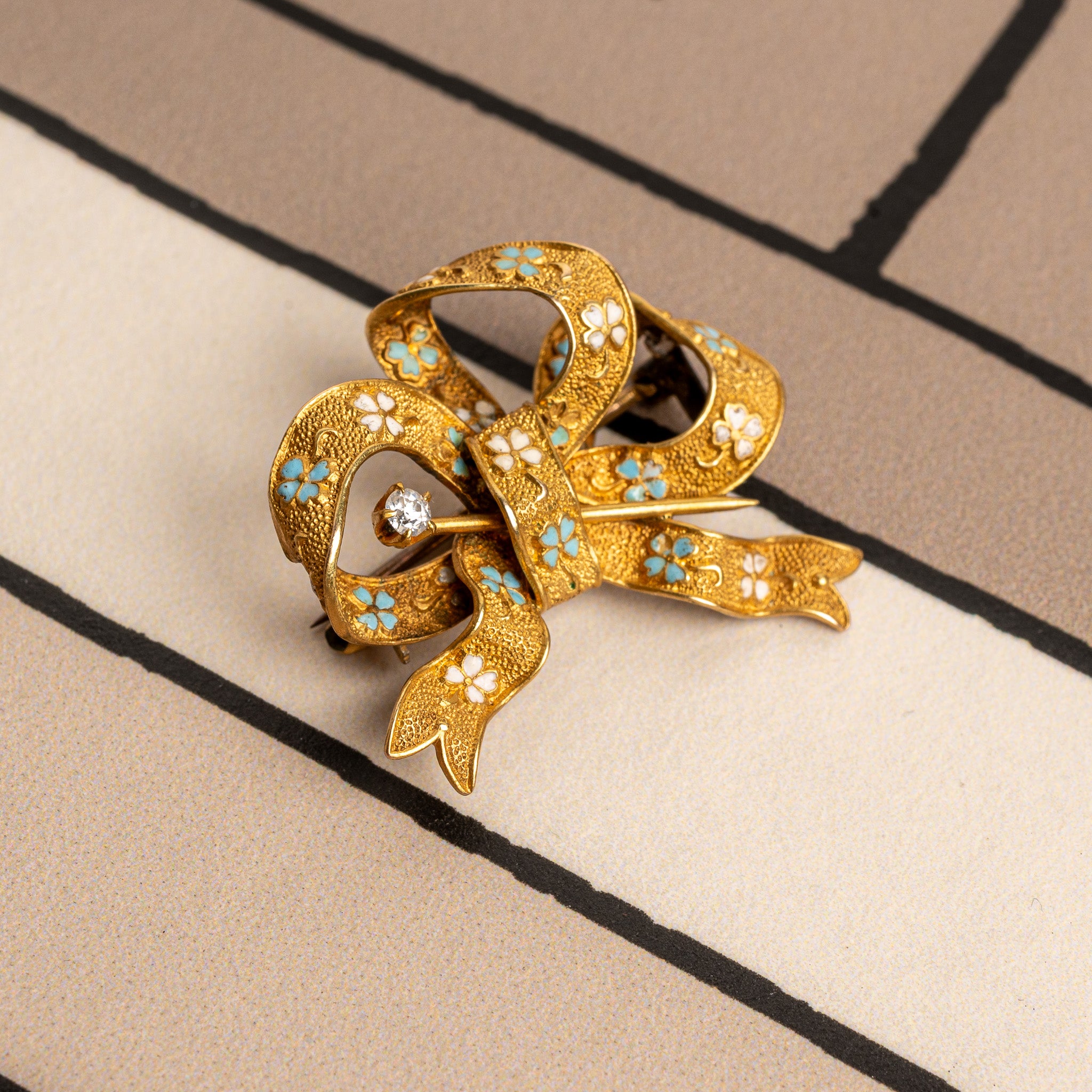 LATE 19TH-CENTURY VICTORIAN 14K GOLD, ENAMEL, AND DIAMOND BOW BROOCH
