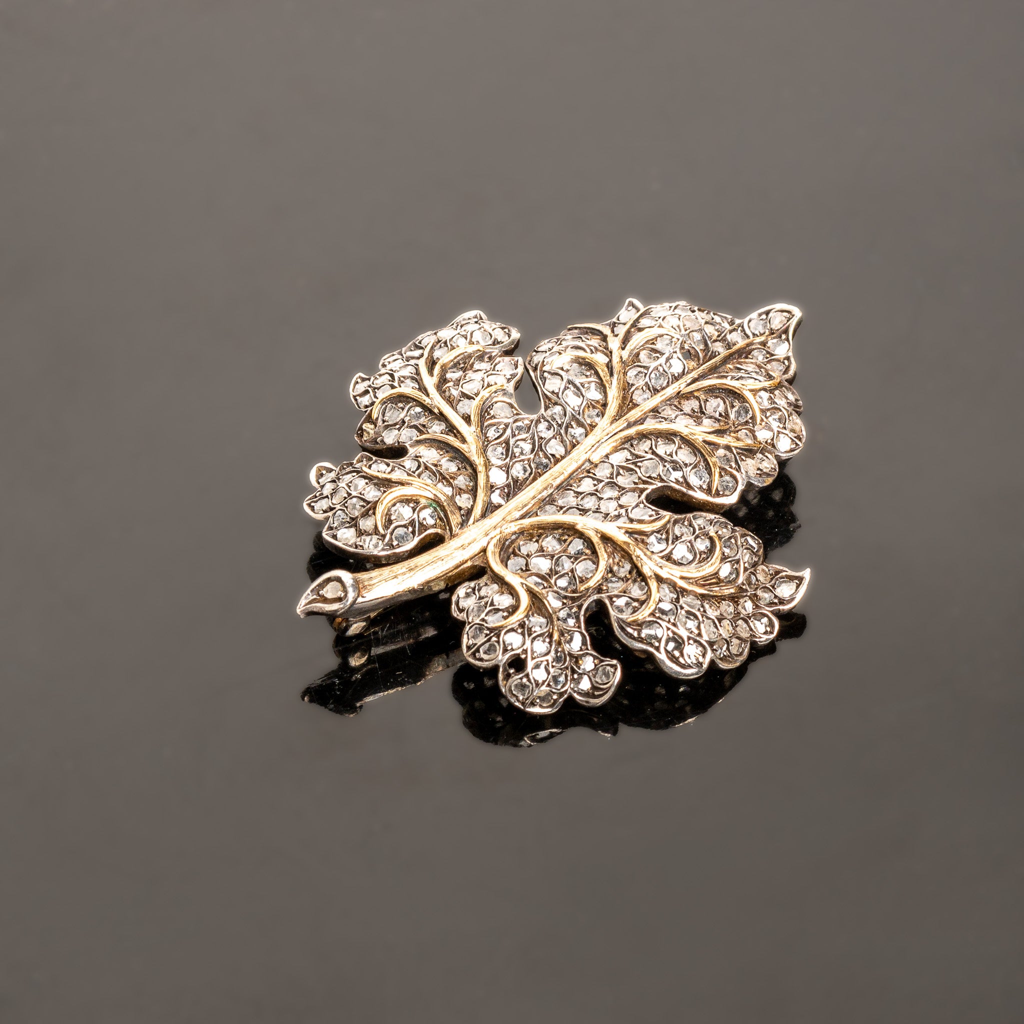 LATE 19TH-CENTURY SILVER, 14K GOLD, AND DIAMOND LEAF BROOCH