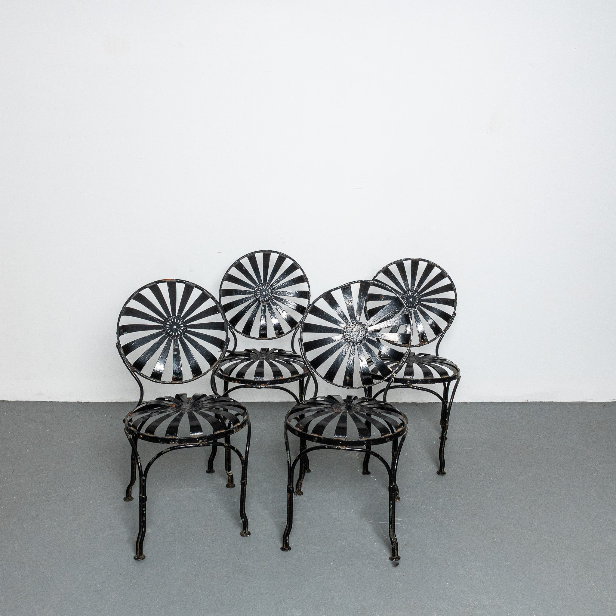 Set of four American Art Deco painted patio chairs
