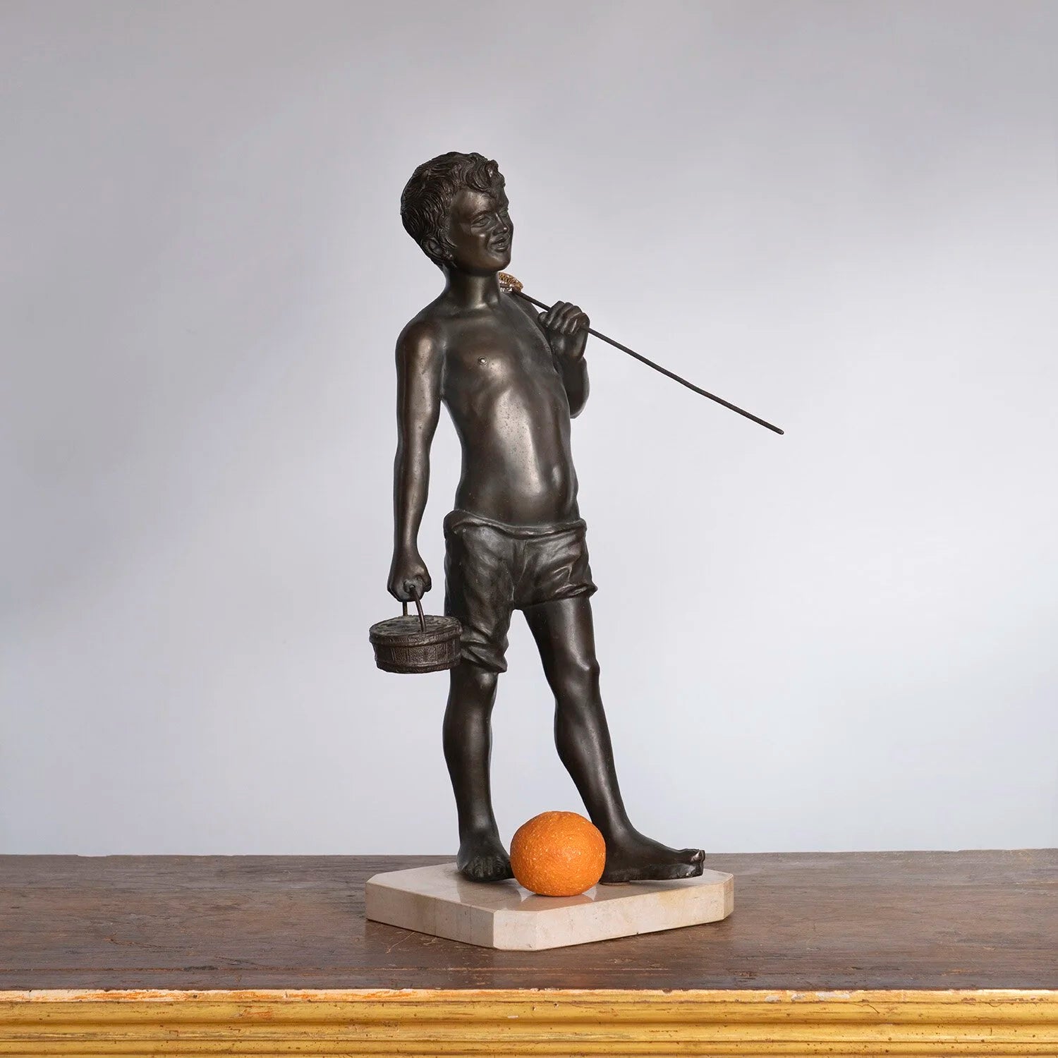 STATUE OF A FISH MONGER