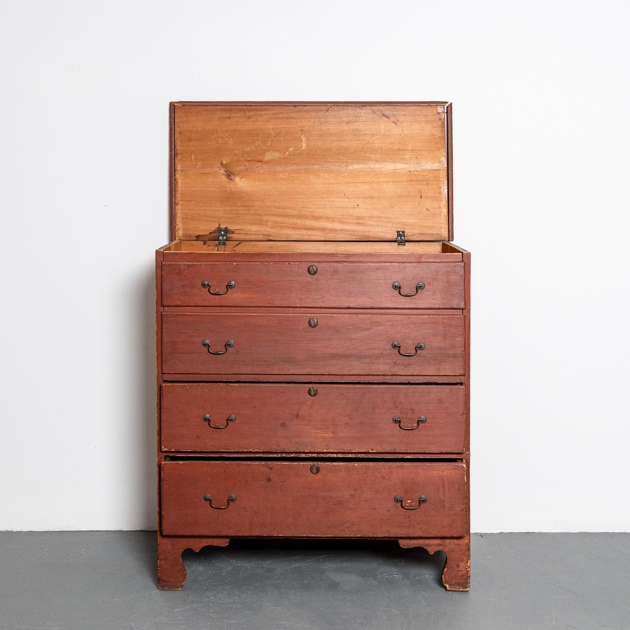 19th century American red painted lift-top chest of drawers