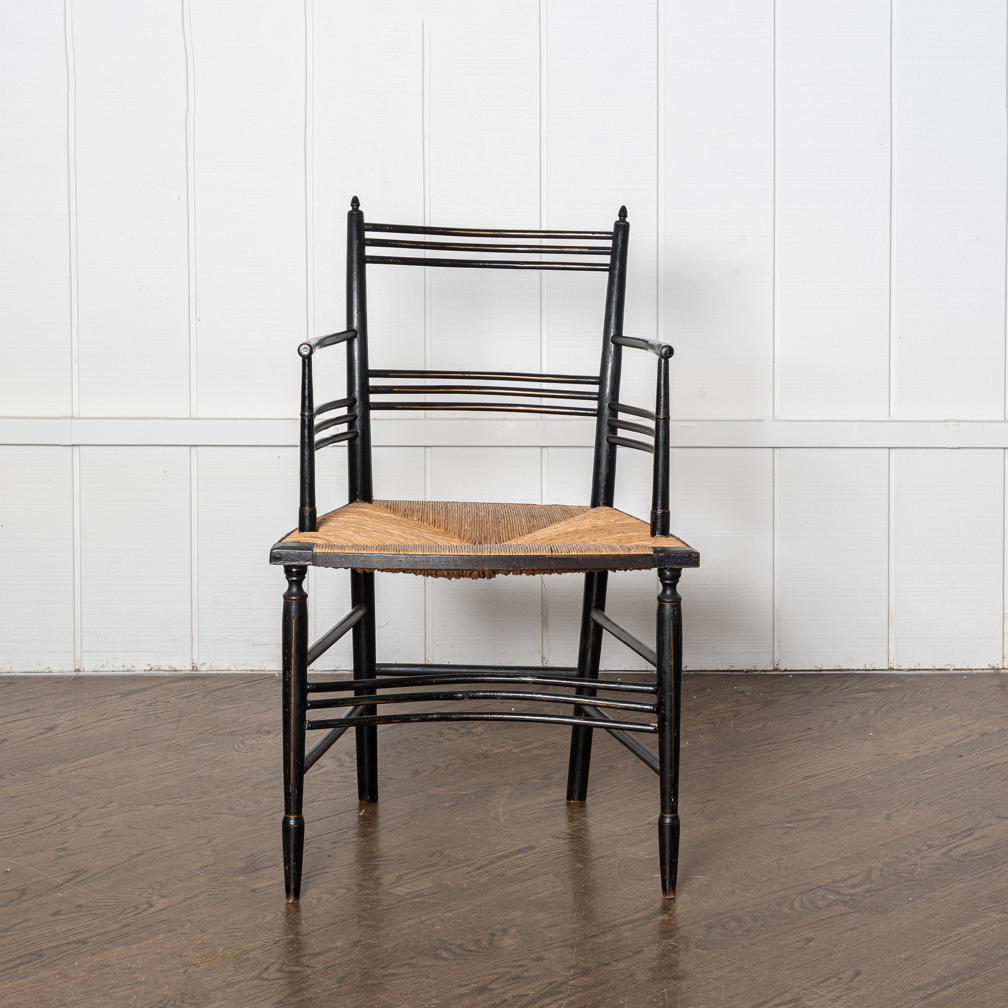 19th century English Aesthetic Movemnt ebonized rushseat armchair