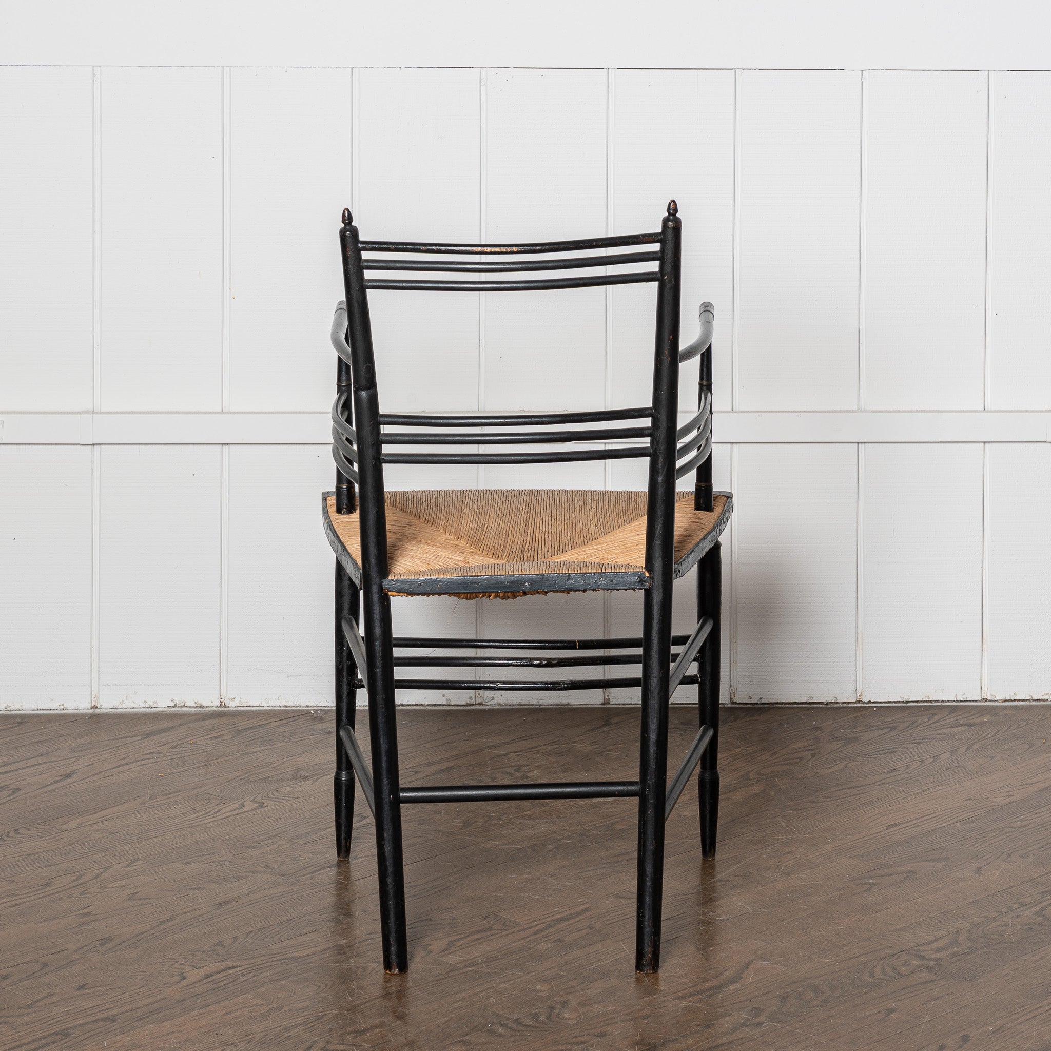 19th century English Aesthetic Movemnt ebonized rushseat armchair