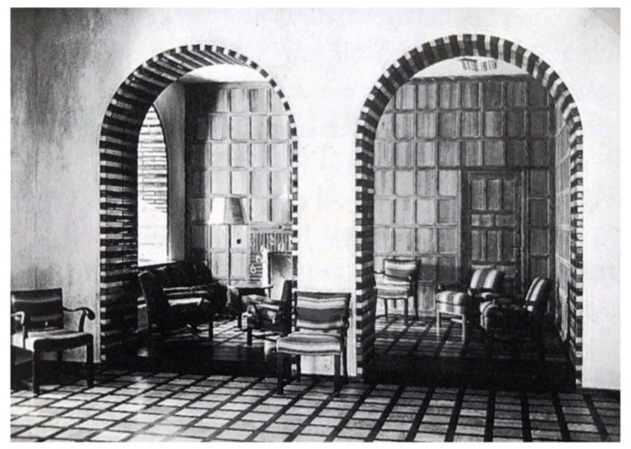 Archival German modernist interior with brick-banded arches, showing chairs of a related design