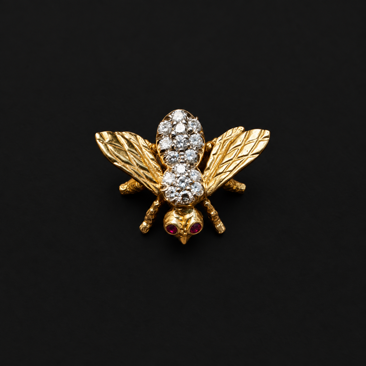 Vintage 18k gold diamond bee brooch with ruby eyes