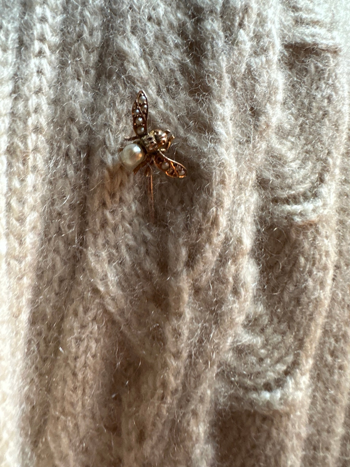 Antique English gold seed pearl bee stick pin on cream cashmere