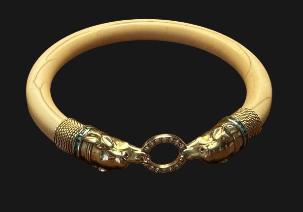French Art Deco hound’s-head bone bangle, actual product photograph on black background